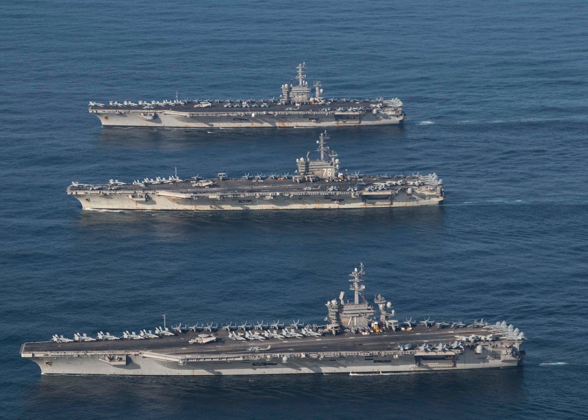 DeptofWar's tweet photo. In case you didn't know, the Navy is still doing what it does best. Projecting power! @USPacificFleet strike groups @Gipper_76, @TheRealCVN71 and @NimitzNews are underway, and conducting operations, in international waters as part of a three-carrier strike force exercise. https://t.co/ku5no5472U
