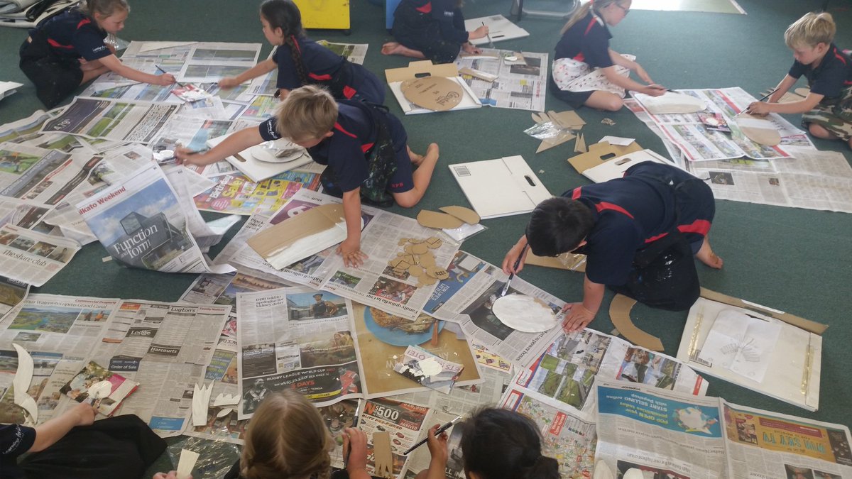 Next stage of creating our cardboard birds - under coating our shapes.