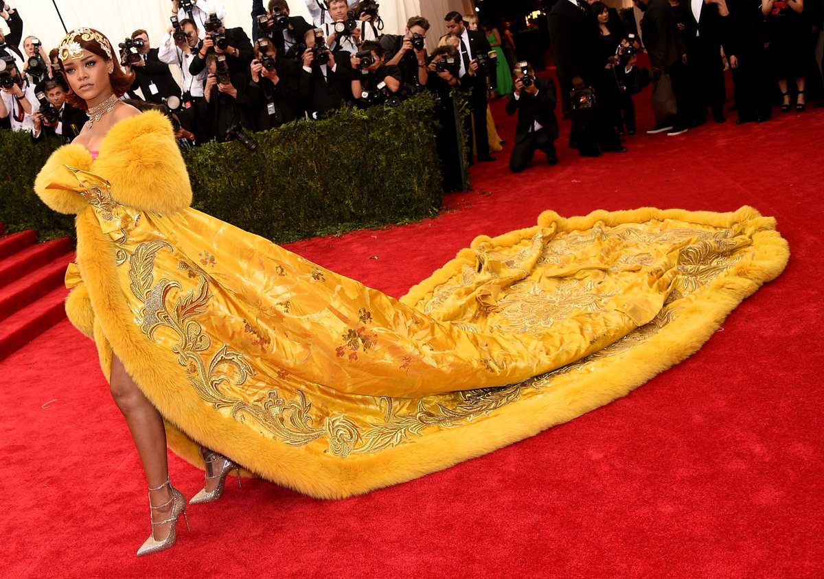 FashionWeek's tweet photo. The 2018 Met Gala Theme has been revealed: "Heavenly Bodies: Fashion and the Catholic Immigration." The cohosts for the night will be @Rihanna, Amal Clooney, and Donatella Versace. Take a look back at some of their most iconic Met Gala looks. https://t.co/PvMPSkMHKr