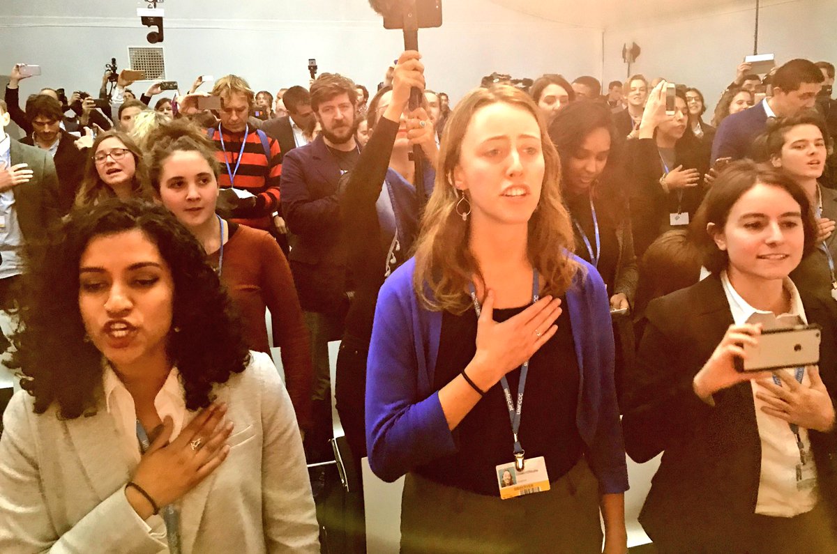 BREAKING: In global show of defiance, US youth lead walk out at White House fossil fuel panel at #COP23 UN Climate Talks singing #WeThePeople.