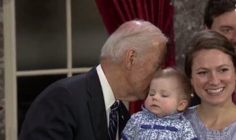 Why must former Vice President Joe Biden habitually smell the hair of the women, little girls, and babies he meets?
