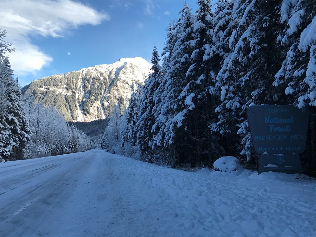 It's a great drive to work on the Tongass National Forest! This is the road to Mendenhall Glacier Visitor Center in Juneau, Alaska on a chilly winter day.