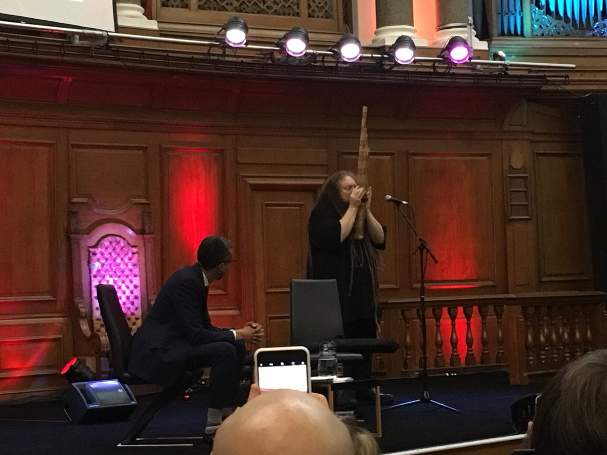 agrun's tweet photo. @intelligence2 #iq2debate we can change the world, Jaron plays the Laotian mouth organ in front of the organ. https://t.co/nLxxhPwHEn