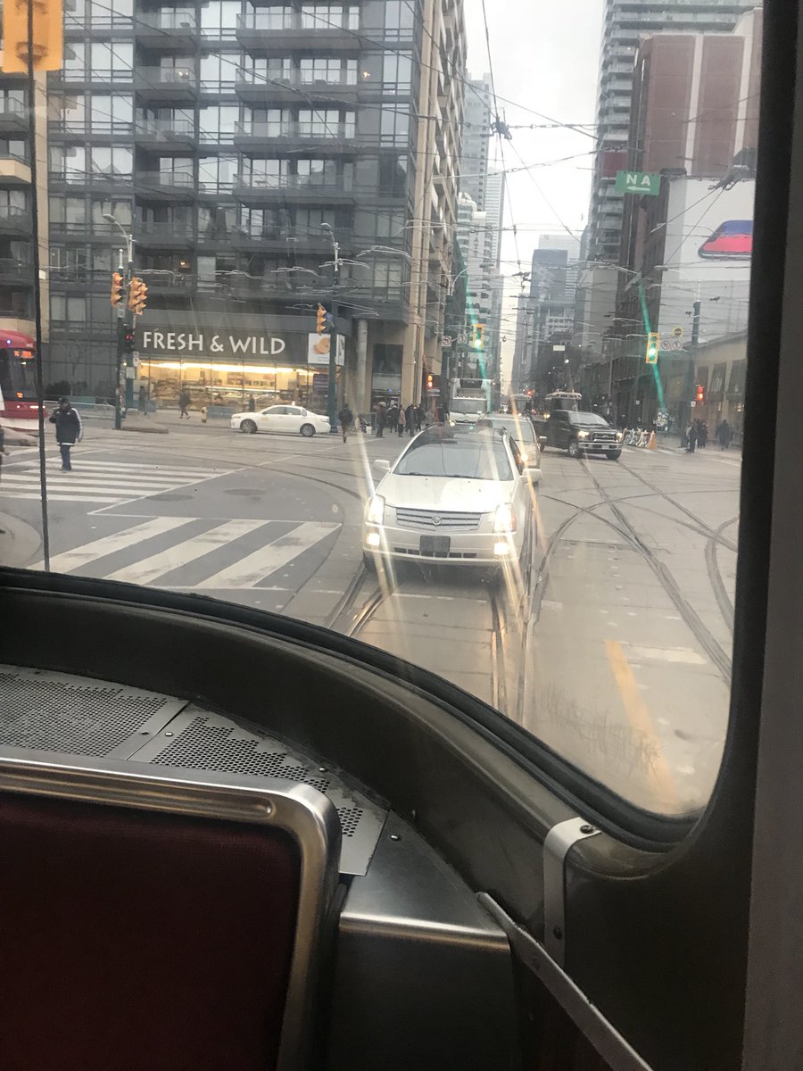Alexandrah_6's tweet photo. @TTChelps this white SUV passed all the way down King from Peter, and then cut in front of the streetcar at Bathurst! Not ok! BTPL 149 https://t.co/05ZkVKToFf