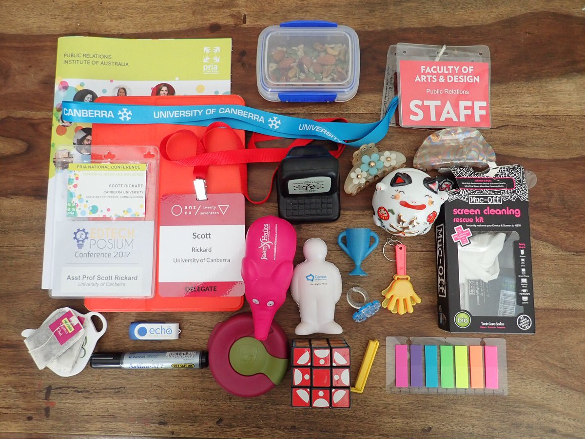 Rickard_Scott's tweet photo. My #academicflatlay showcasing events from the last month, and random items from my desk #stillloving my #CanvasLMS #RubriksCube from @EdTechPosium https://t.co/lw1qWedPF6