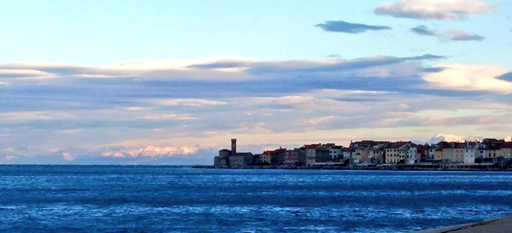 MiguelAEGEE's tweet photo. Piran. The quiet sea, the Sun in the sky, the snow in the mountains. Day 2 of the #BlueMission training at @EMUNI serving 50 shades of blue. https://t.co/wqsQmgVyv7