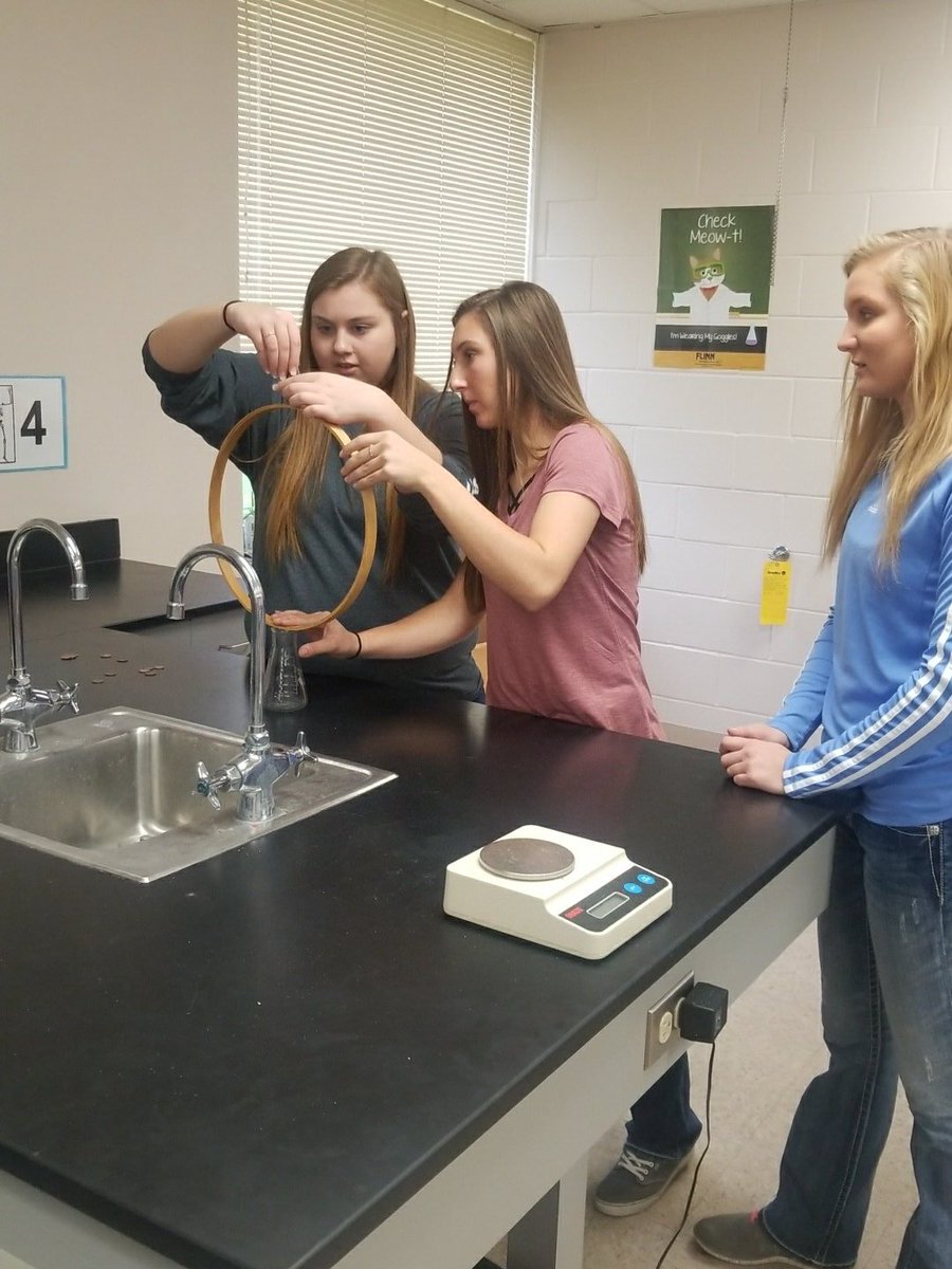 MrsEllingsonDCG's tweet photo. It's the annual Newton's 1st Law challenge in physics today.  The record to beat is still 67 pennies from 2015. https://t.co/u4OkobhS21
