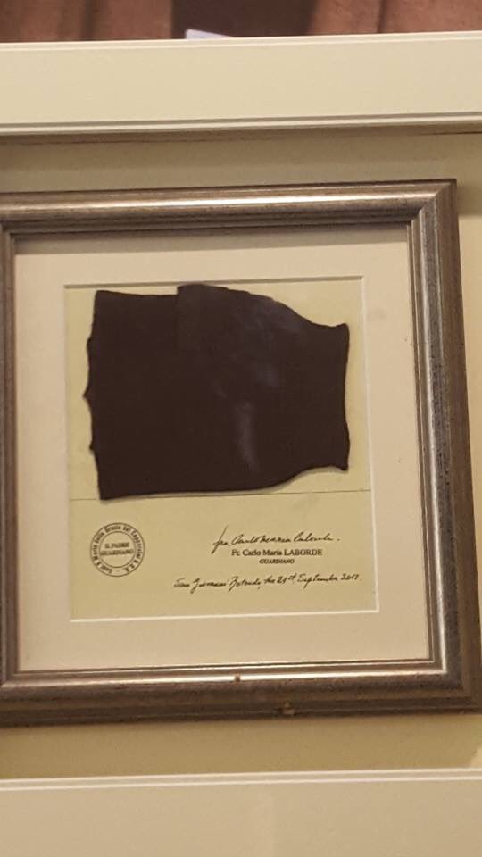 TheCrosshill's tweet photo. Our framing project:
A special frame was needed to display St Padre Pio’s image and glove. A door was provided at the back of the frame with security fittings to accommodate a padlock. The glove can now be removed when visiting the sick. https://t.co/4M2LTo3QoE