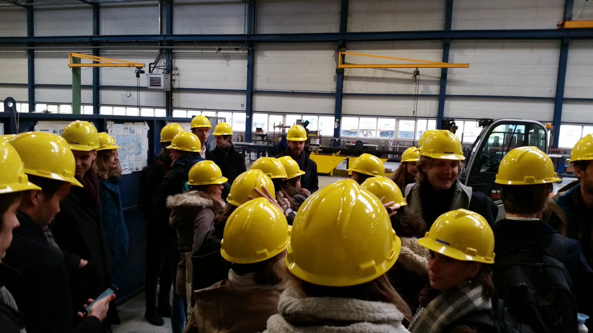 ScienceWorks_NL's tweet photo. Students in the yellow helmets enjoying the tour at Damen Shipyard! #src2017 #socialprogramme https://t.co/40oQi7HatM