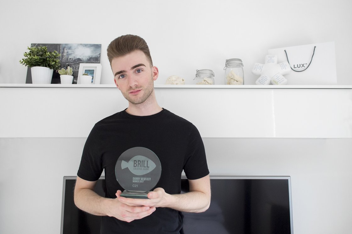 C21createchange's tweet photo. Danny Webster, the #winner of our 2017 #brillaward with his hands on the shiny trophy. #CreateSalford @SalfordUni @createatsalford #graphicdesign https://t.co/Fe0R7rCyal