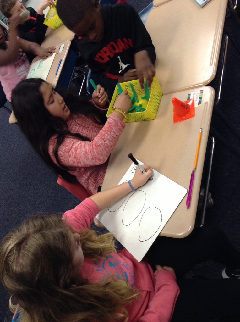 HLDuchene's tweet photo. Working on understanding Partial Quotients using manipulatives. #teamwork #conceptuallearning #rockmath @EdwardBestFCS @ECUcrystalECU https://t.co/XJK0zogVnj