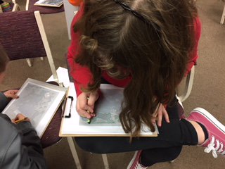 SethAStark's tweet photo. The 4th grade class at Decatur LSA had a great time learning about making maps from aerial photos yesterday for #GISDay! #GIS #maps #DecaturIL #geography https://t.co/oxPHYNfNIF