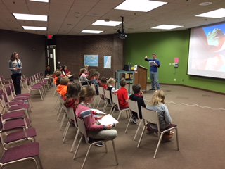 SethAStark's tweet photo. The 4th grade class at Decatur LSA had a great time learning about making maps from aerial photos yesterday for #GISDay! #GIS #maps #DecaturIL #geography https://t.co/oxPHYNfNIF