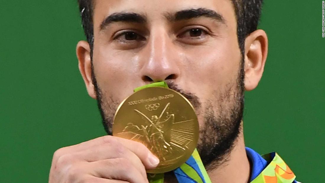 cnni's tweet image. Iran's Olympic weightlifting champion Kianoush Rostami has put his gold medal up for auction to raise money for the victims of Sunday's earthquake cnn.it/2AH4KBq