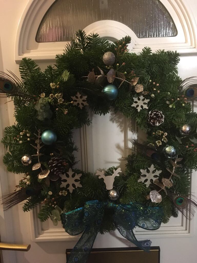 #Christmas #wreath using #peacock #feathers. Love this pretty look - will it be perfect for your front door?! #flowers #surrey #florist
