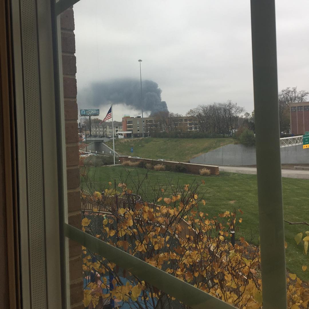 seeingdandy's tweet photo. My husband sent me this picture from his office at 11am. It's of the five-alarm fire near downtown #stl. At 4pm the warehouse is STILL burning. Why? Well, imagine this irony... the warehouse stores 150,000 citronella #candles. ๐ณ #stlouisfire #botanical #stlouis #explorestlouis https://t.co/8WJyHXy7Bv