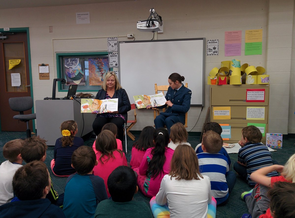 MrsColvinsClass's tweet image. Thank you to Mrs. Norman from the Rotary Club and Aviator Traill from the Canadian Air Force for reading to us today.  Every grade 2 student took home a copy of the book.  Thank you Rotary Club!