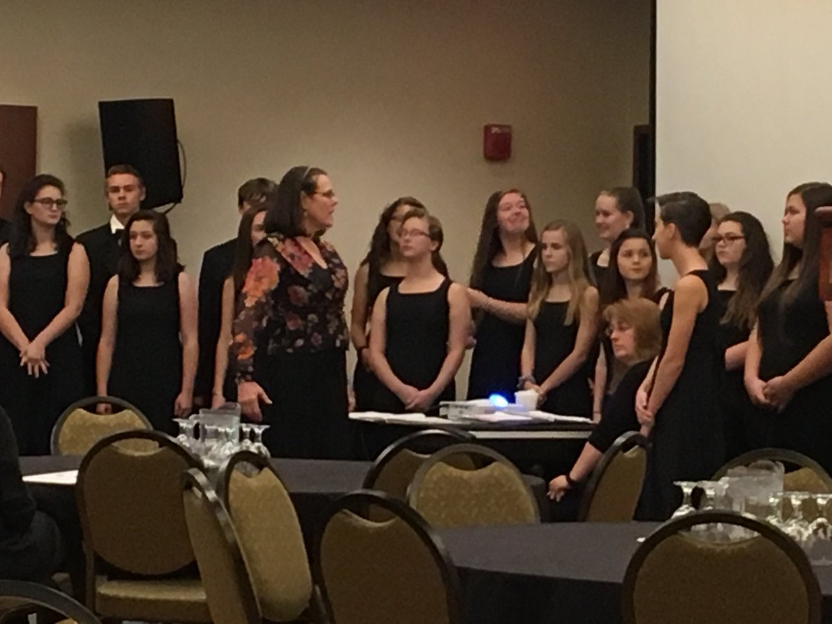 Former SHS Chorus Director Sue Proulx leads the Westbrook Chamber Choir during the MPA Principals Conference. #MPAconference