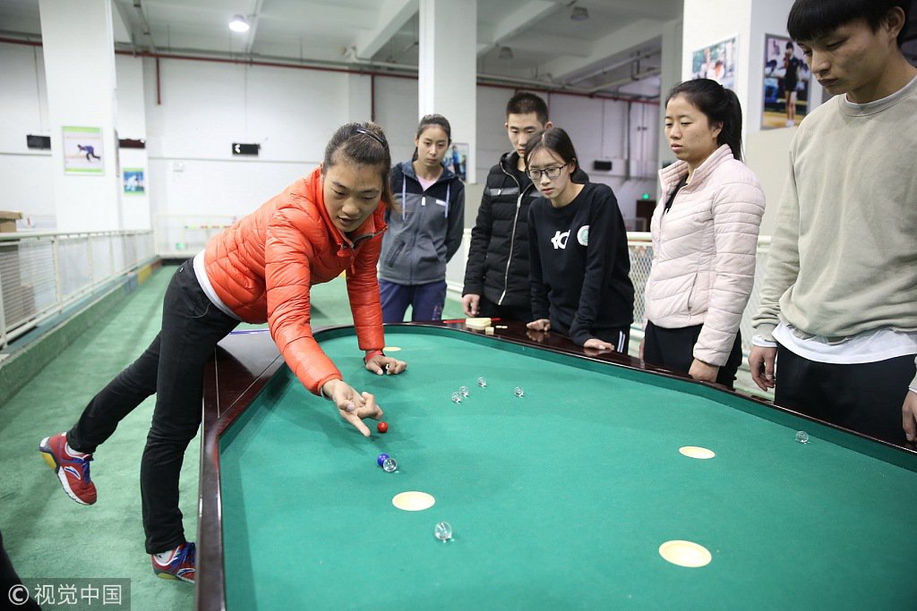 CGTNRadio's tweet photo. A university in Xi'an teaches students to play #marblegames. The game is currently the smallest ball game in the world and it was officially recognized as a formal sport by the General Administration of Sport in 2003. https://t.co/xfhI3HqiBU https://t.co/MUTyF2xrvV
