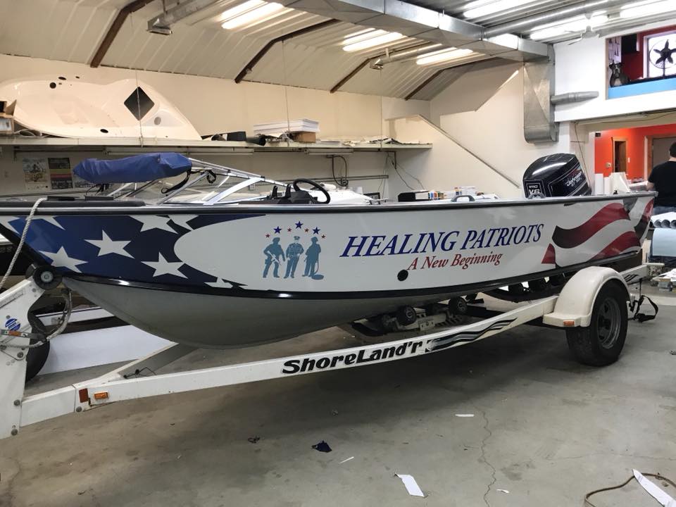 HealingPatriots's tweet photo. We now have 2 boats wrapped and are getting ready for our 2018 #HealingPatriots expeditions. Thank you @teamescape262 @RTSFundraise and Gator Signs in MN for your partnership with our boat wraps! #partnerships https://t.co/HAchtMmLEI