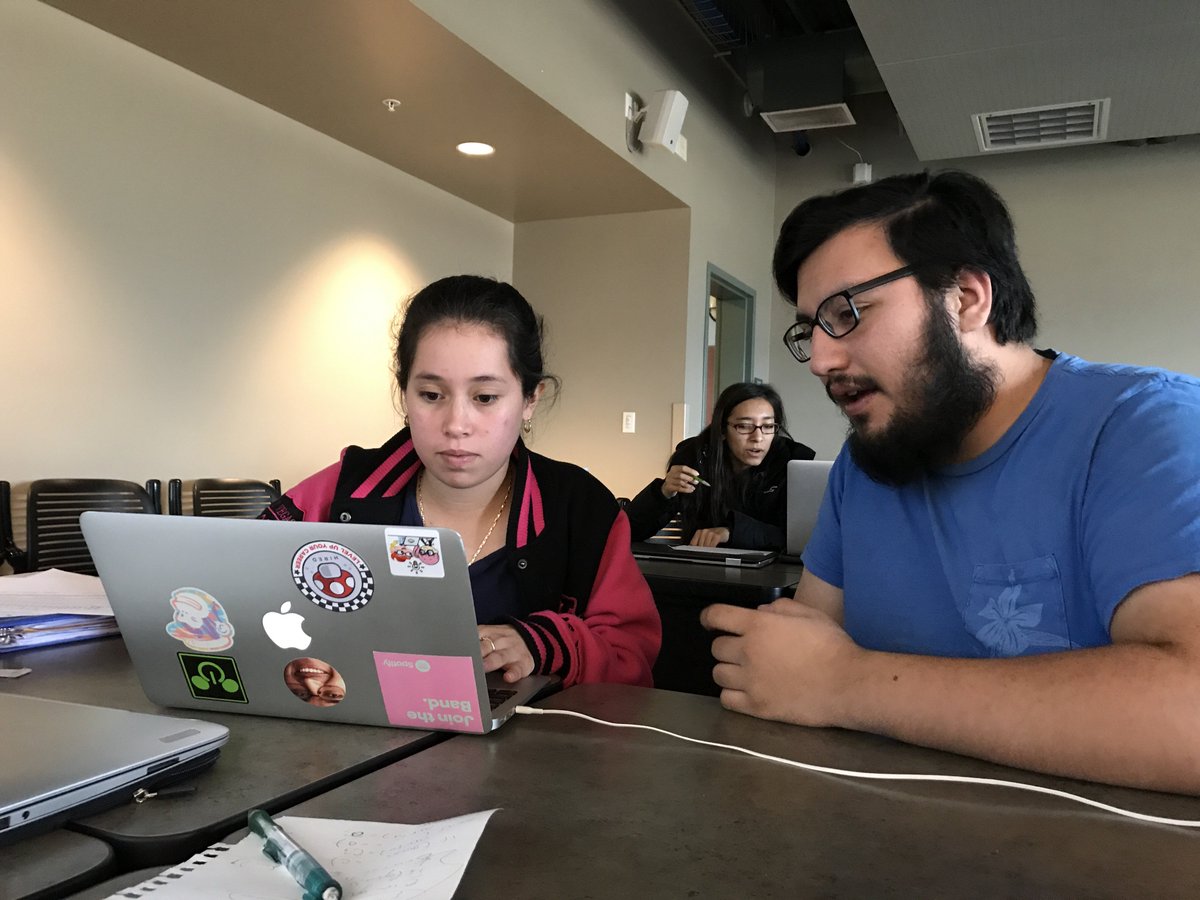 csinthree's tweet image. Cohort students, Andrea and Luis, programming a hangman game during #fce.