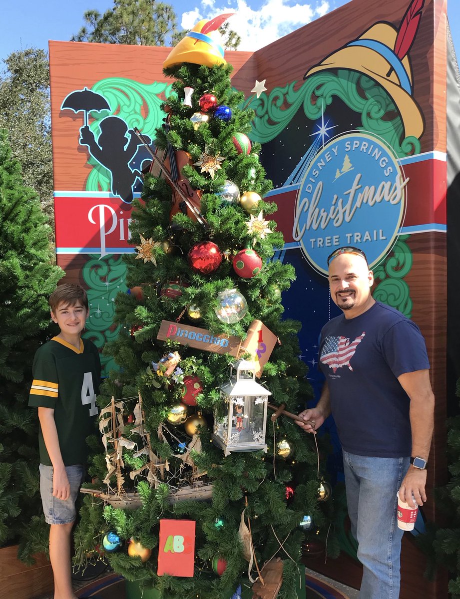 DezStudio's tweet photo. Christmas Tree Trail #DisneySprings - a tree for every Disney Film ... and Santa too! https://t.co/wnwspBLcmu