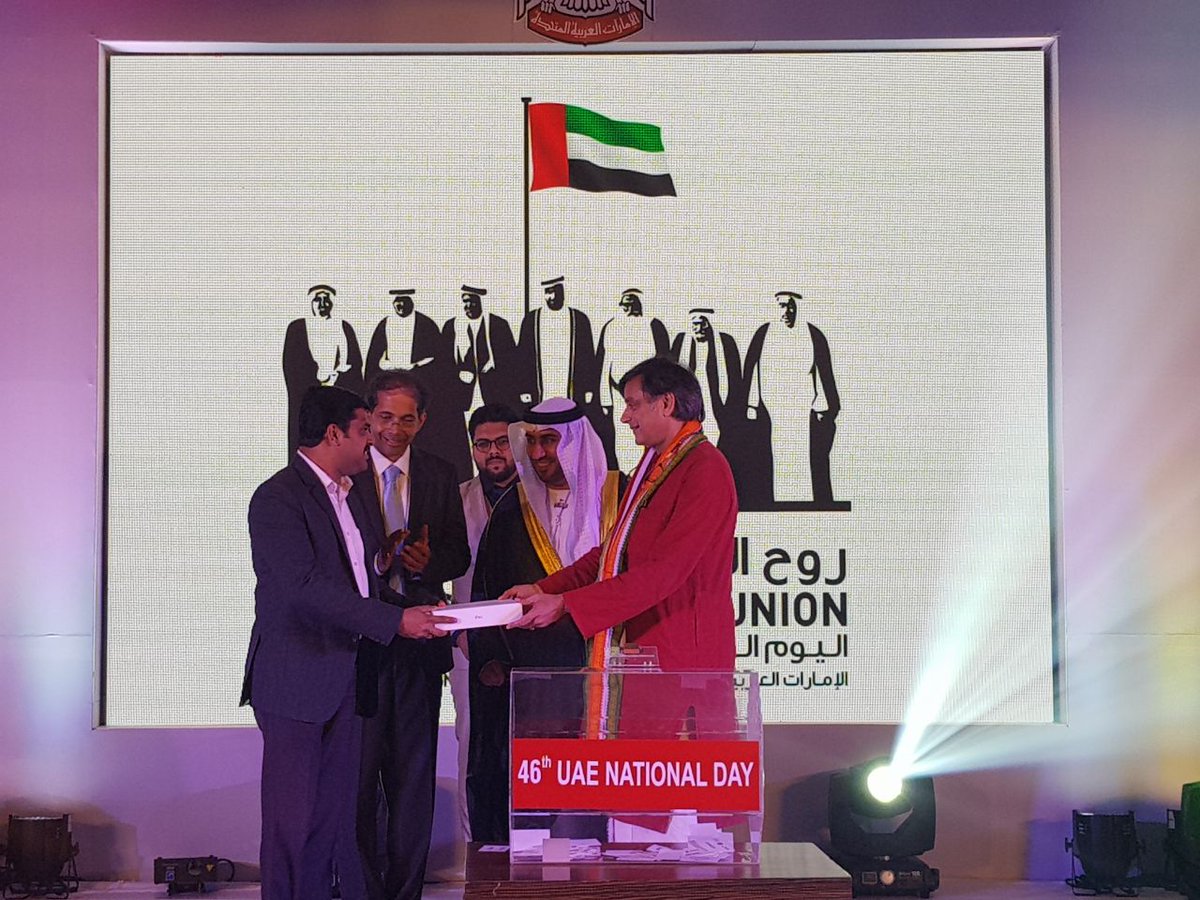 ShashiTharoor's tweet photo. After a day in the face of calamity, briefly joined UAE ConsulGeneral in Thiruvananthapuram, JamalAlzaabi, for #UAENationalDay46 &amp;found myself doing the lucky draw! @UAEEmbassyIndia @MOFAUAE https://t.co/ACfMeXLsm6