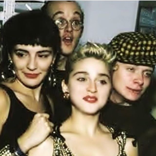Madonna's tweet photo. In honor of World AIDS Day!! Im posting this photo of me with 2 of my dearest friends who died of AIDS. Kieth Haring and Martin Burgoyne. I Loved them both dearly! ♥️ We can never forget the lives lost by this disease!! And that there is still no cure... https://t.co/OhkRYXiR98 https://t.co/OFdTzwJbr9