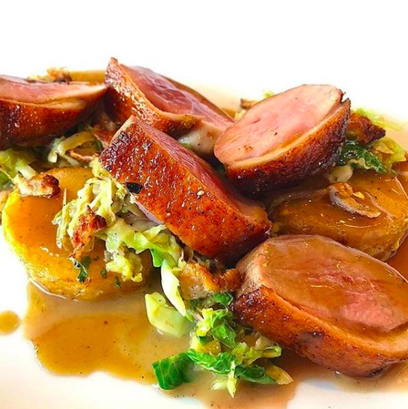 A new addition to our menu, Duck “Charcroute Garni” glazed with honey and served with braised cabbage, brussels sprouts, duck confit, duck fat potatoes and crispy duck skin.