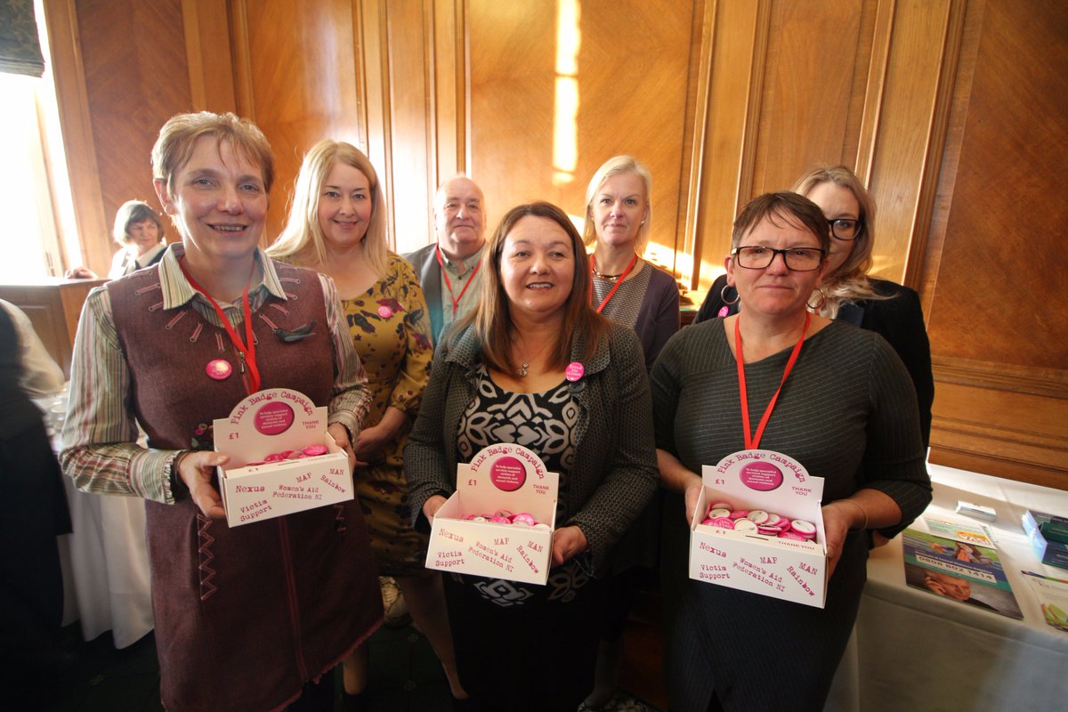 WomensAidNI's tweet photo. We launched our #PinkBadges today in Stormont along with @MichaelaBoyleSF @NEXUS_NI @VictimSupportNI @MensAdvisoryP @TRPNI and Men's Action Network. Keep an eye out for our boxes of pink badges in locations near you soon! https://t.co/ONvtjIci6q