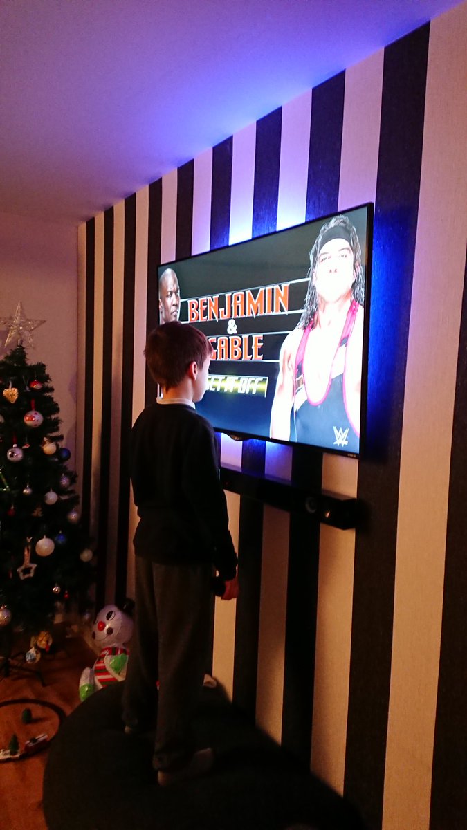 Wwe_star88's tweet photo. This song is constantly on repeat in our house p.s. @Kaydensjourney is blind but loves getting close to tv @Sheltyb803 @WWEGable #setitoff https://t.co/Djf8Qj6Luu