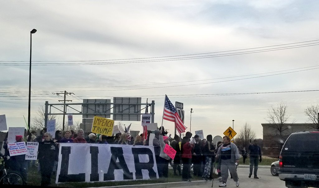 FHCToday's tweet photo. Outside the St. Charles Convention Center, protesters and counter-protesters gather before President Trump's speech on tax cuts. https://t.co/HTBc0zaQWa