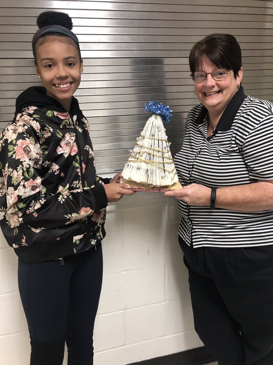 Creativity at its FINEST ... Our Media specialist is the BOMB.COM #repurposewithapurpose #recycling #oldandwornnovelsmadeintobeauty #middleschool #dedicated #mediacenter #bookangelsandtrees