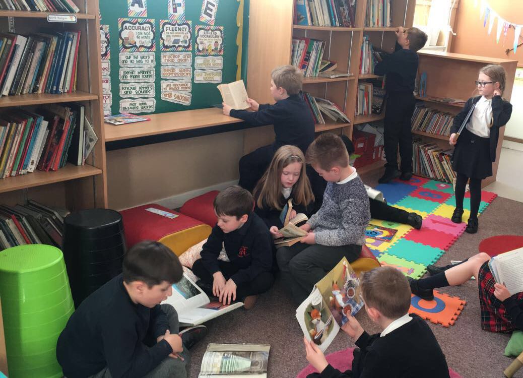 WBurghPrimary's tweet photo. Primary 3b enjoying some quiet time to read in the library after all those activities. I think they deserved the break! #BookWeekScot #WillybugReads https://t.co/ONIbQ7fIB4