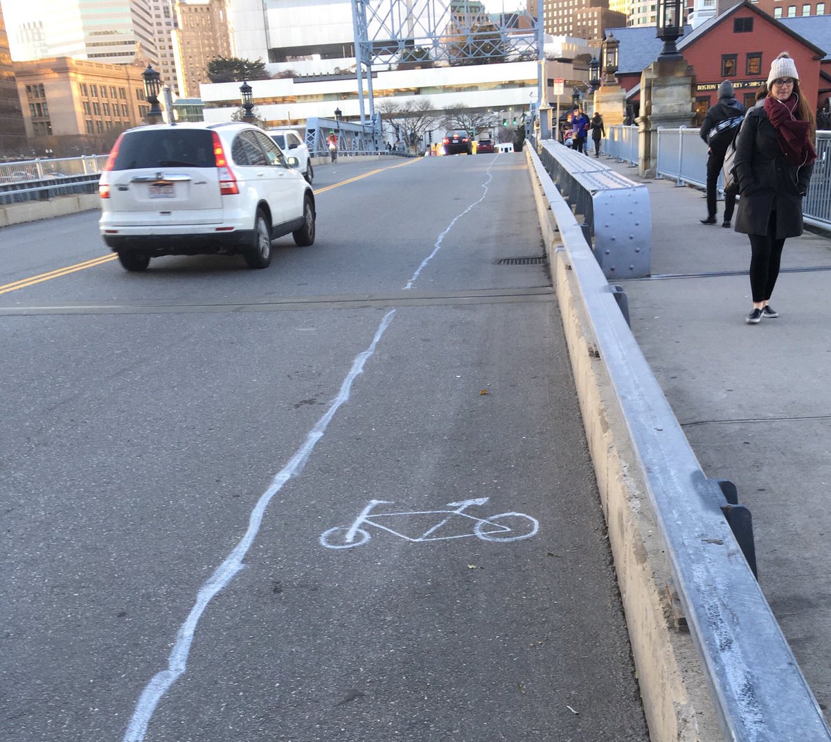 BostonTweet's tweet photo. Someone wanted a bike lane on the Congress Street Bridge (Fort Point) - so they drew one. https://t.co/DEFEYftbzL (h/t @ItalianInBoston) https://t.co/3t1N6XztJu