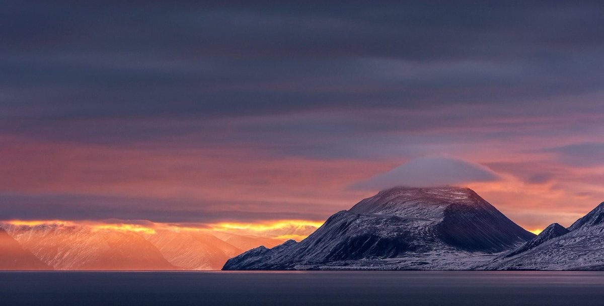 Sunrise as it appears from the shores of the entrance to Pond Inlet, Baffin Island Nunavut. Living on the top of the world has its perks. #Baffin #Island #Nunavut #sunrise <a href="/AdventureCanada/">Adventure Canada</a>
