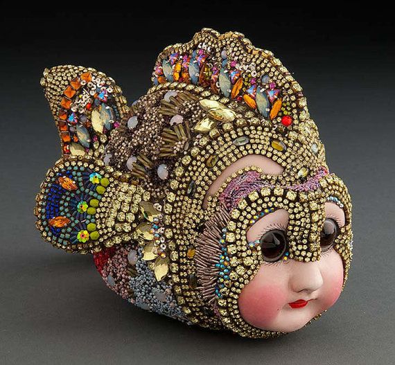womensart1's tweet photo. Betsy Youngquist, multi media artist who creates sculptural mosaics using beads and antique porcelain doll parts #womensart https://t.co/KstxpS3Cqi