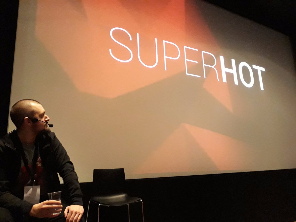 InteractiveDK's tweet photo. And now it's time for Marcin Surma, art director for @SUPERHOTTHEGAME being interviewed by @DFIgameoffice|s Simon Løvind. BTW - did you know, that you can get the aet book for Superhot for free here: https://t.co/YZgLq4NZOz #PLAY2017 https://t.co/BRwUY3D71F