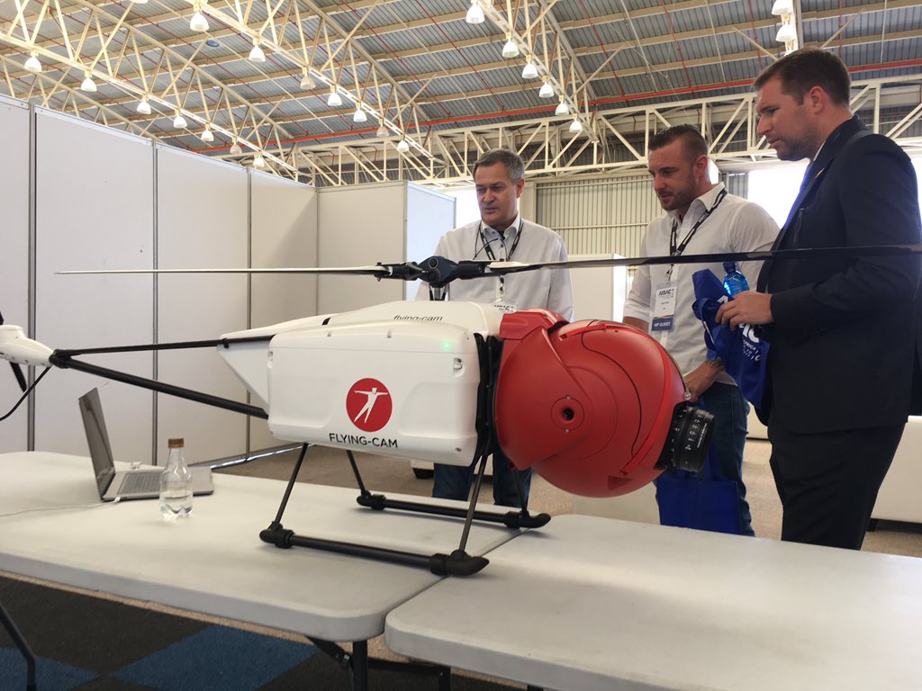 KatyGlynnBZD's tweet photo. Emmanuel Previnaire of #FlyingCam explains the SARAH Platform #Unmanned Technology at #AfBAC17 in Johannesburg, South Africa https://t.co/ud3aLYEboo