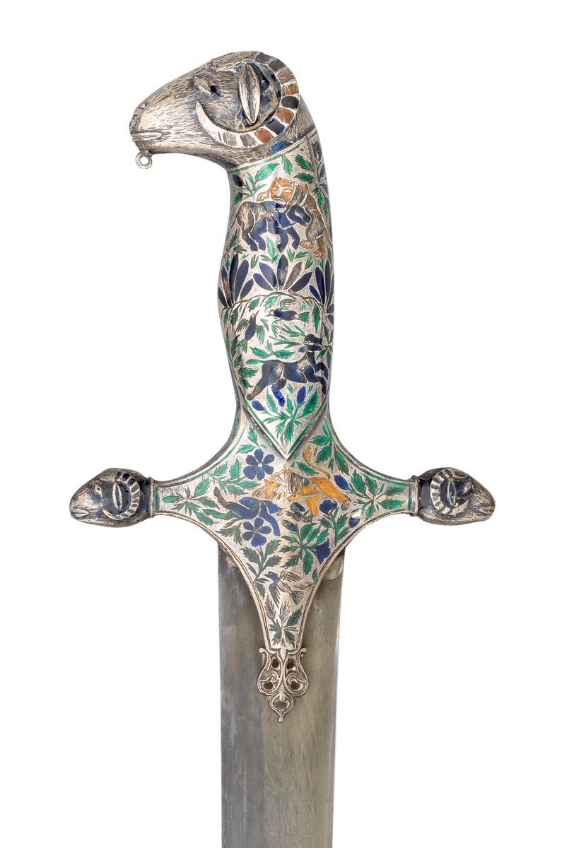OlympiaAuctions's tweet photo. A fine enamelled silver hilt, Lucknow, first half of C19th. The straight quillons have ram’s head terminals, & grip rises to a ram’s head pommel. The surface is chased & enamelled in polychrome with foliage inhabited by exotic animals & birds. #hilthighlight #ThomasDelMar https://t.co/QqKnVfkKEE