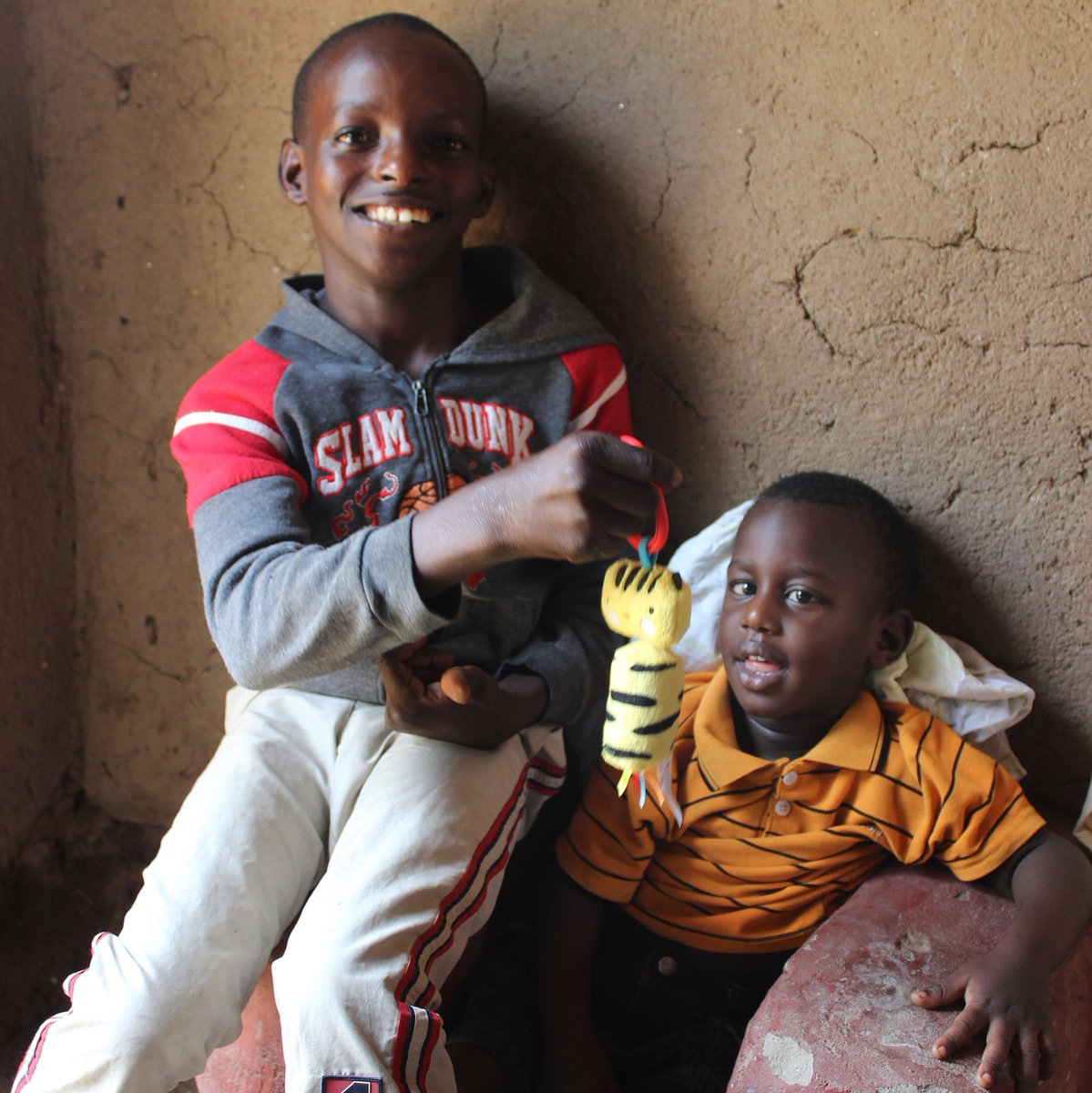 DFID_UK's tweet photo. Shima was born with multiple disabilities and was abandoned as a baby.

Thanks to #UKaid, @HopeandHomes introduced him to a loving foster family. Here he is with his new brother, Amiable, who has become Shima's special champion. 

#LeaveNoOneBehind #IDPD https://t.co/dqJD0imQZu