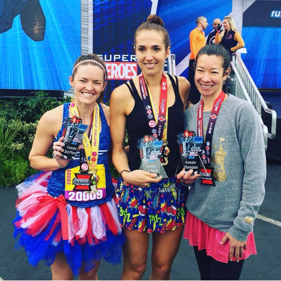 SparkleAthletic's tweet photo. #TBT: We love this pic from this year’s #runDisney #AvengersHalf... it’s not every day that #teamsparkle dominates the podium. Congrats again to @jenn_berry1 (1st), @linake88 (2nd) & @keltinkerbell (3rd) - we're so lucky to have all of you representing #teamsparkle. 🎉🎉🎉 https://t.co/ka4UPUr7Cy