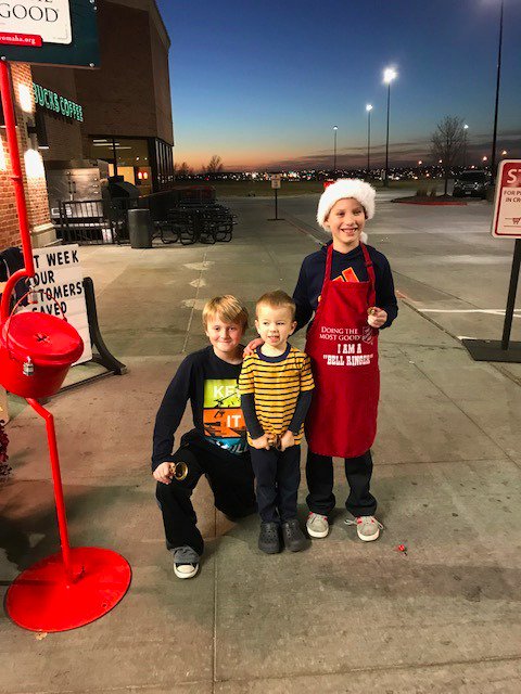 Grace Abbott students ringing bells for the Salvation Army.