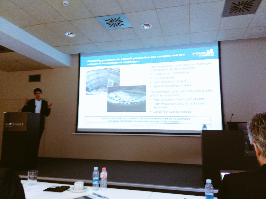 FourByThree_PRJ's tweet photo. Tobias from ZeMA presents the 3rd pilot scenario: Premium Aerotec, where FourByThree techonology has been to used to implement collaborative riveting of large parts for the aerospace sector. This process, when done by humans, is time-consuming, repetitive and unergonomic. https://t.co/5hwxi1AWq0