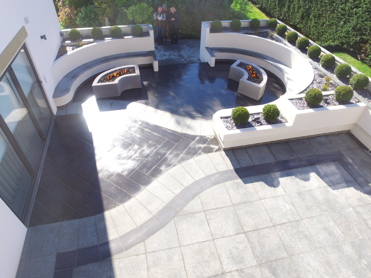 Dawsonlandscape's tweet photo. Lovely job just finished @MarshallsReg granite dark paving with Symphony verified plank paving in char colour and granite bespoke seating  #best by far #Dawson Landscapes Ltd https://t.co/W99AjGfuvH