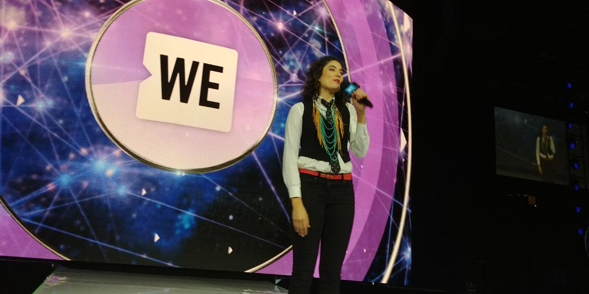 WEMovement's tweet photo. 'Here's your gentle reminder that we are still here' — slam poet Rebecca Thomas says from the #WEday stage. 'In spite of generational trauma + cultures of fear. And we are getting better.’ #ThursdayThoughts https://t.co/RawMnD6gS6