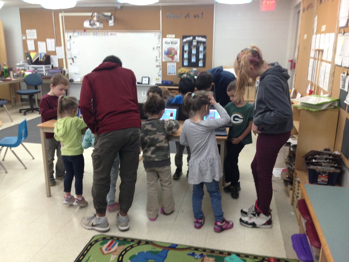 Grade 8 helpers assisting kindies using Chrome books to access games to increase their numeracy skills <a href="/CundlesHeights/">Cundles Heights PS</a>
