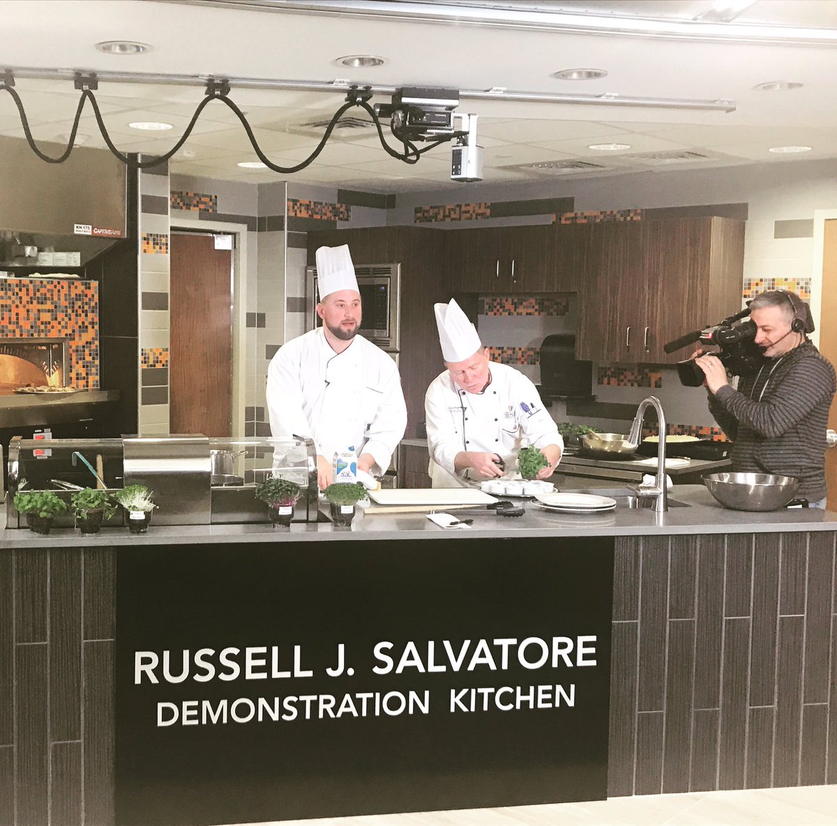 buffalostate's tweet photo. The use of local produce from supermarkets, the Lexington Co-op, and urban farms is on the rise. Chef Steve Burgeson and graduate student Peter Flanagan discuss the microgreen trend in #foodservice in the demonstration studio in Caudell Hall. https://t.co/e2pdbosEcI