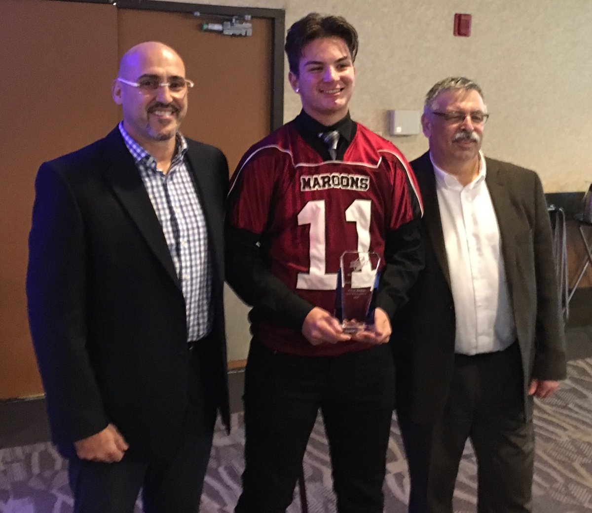 JDzikowicz's tweet image. Congratulations to Kieran Benson, QB of the DMCI Maroons on their undefeated season and first Championship in 39 years. Kieran was presented the Winnipeg Blue Bomber Alumni Award. Pictured with WHSFL Commissioner Rick Henkewich and Blue Bomber Alumni President Jayson Dzikowicz.