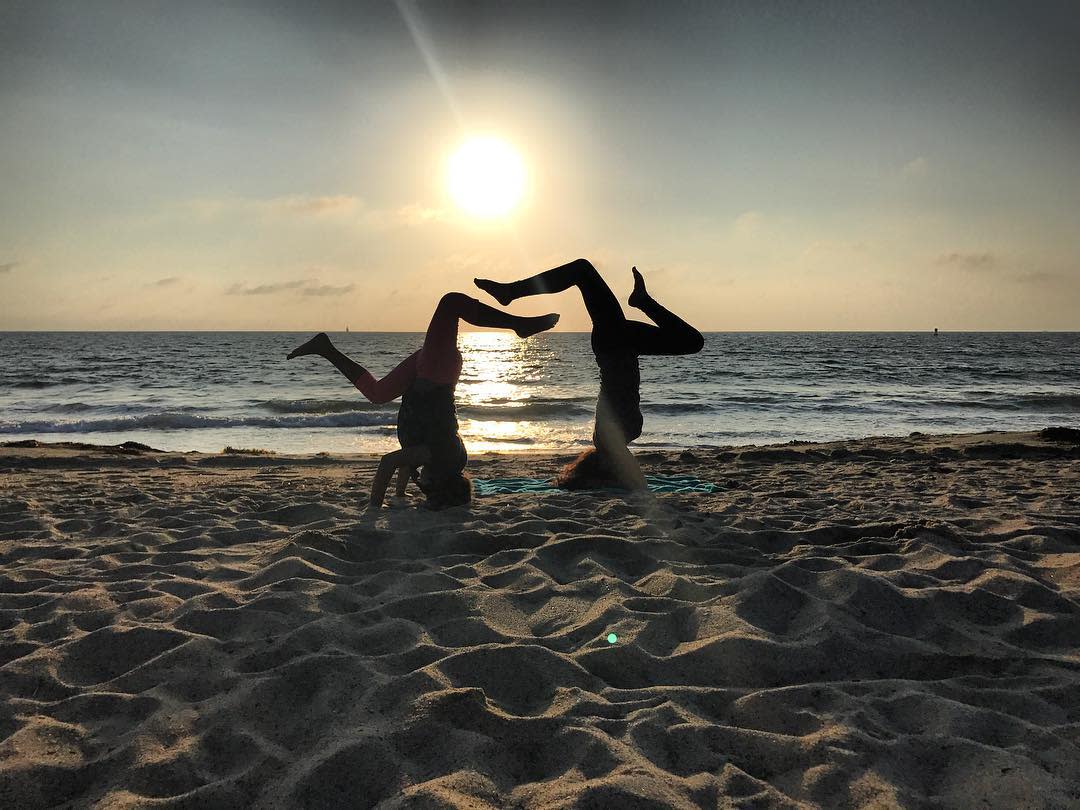 TRBMarriott's tweet photo. Turn your world upside down with a relaxing beach-front yoga session. 📷: sotolex https://t.co/CuR089D3O7